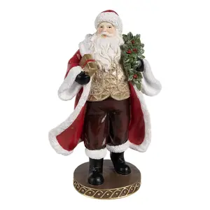 Červená vánoční dekorace Santa s dárkem - 13*10*23 cm Clayre & Eef